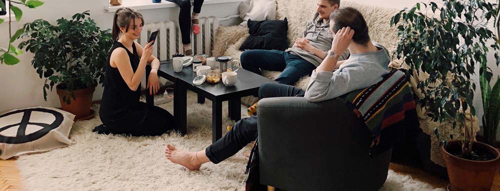 Adults in apartment living room