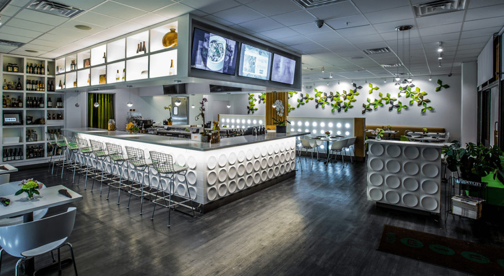 green grey and yellow leaf shaped acoustic tiles on restaurant wall