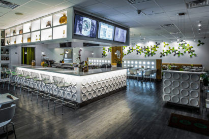 green grey and yellow leaf shaped acoustic tiles on restaurant wall