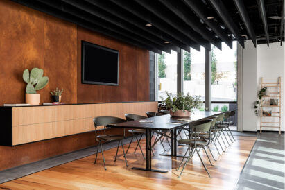 black baffles in conference room over table and chairs