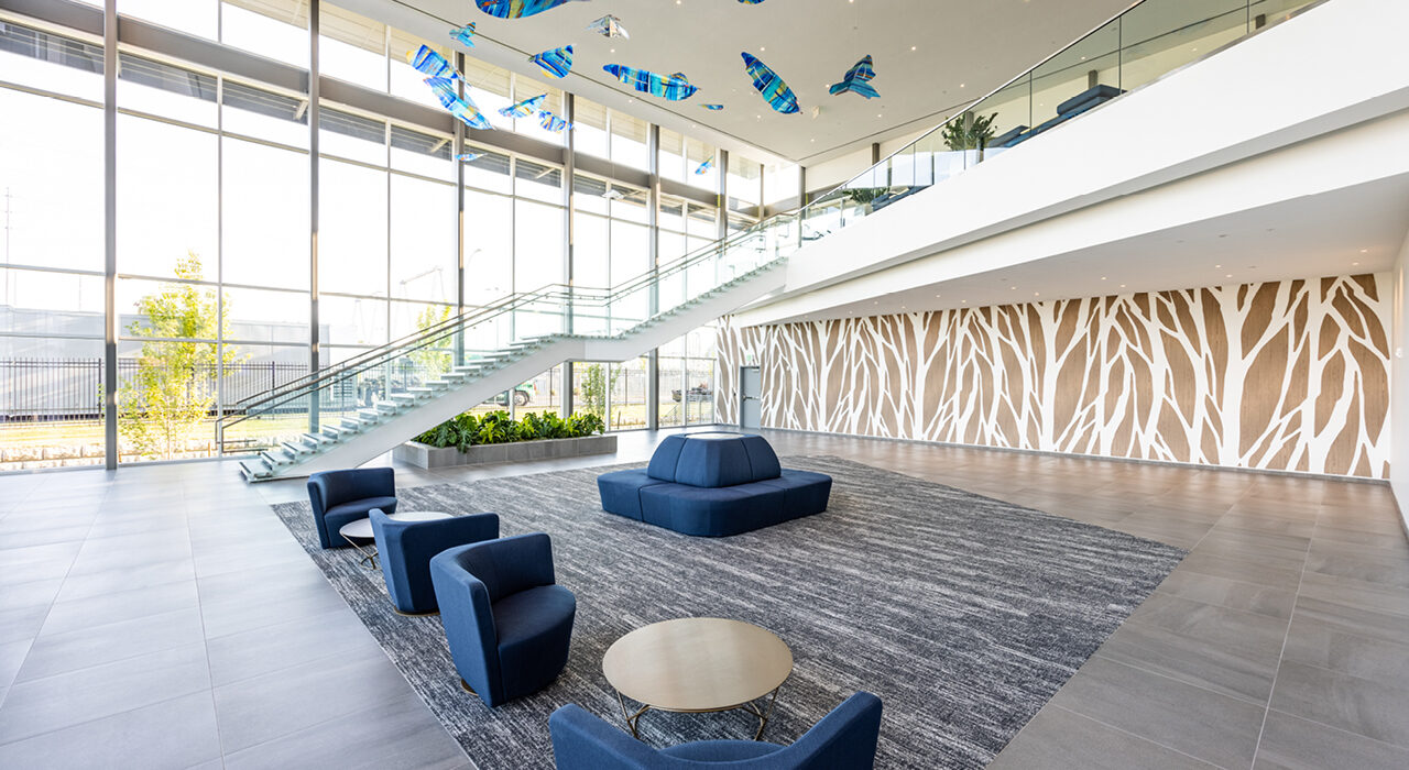 custom cut digitally printed acoustic panels featured on back wall of lobby