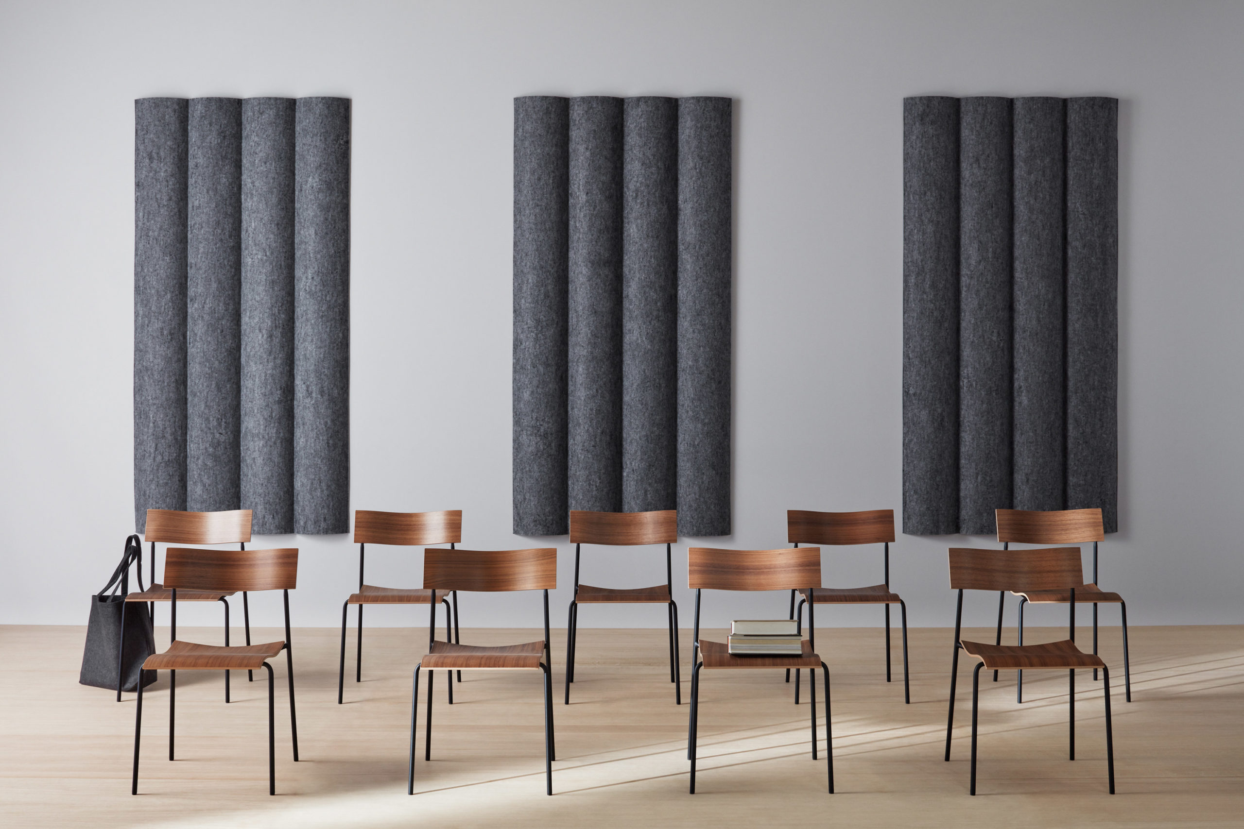 dark grey scala xl convex acoustic tiles on wall behind classroom chairs