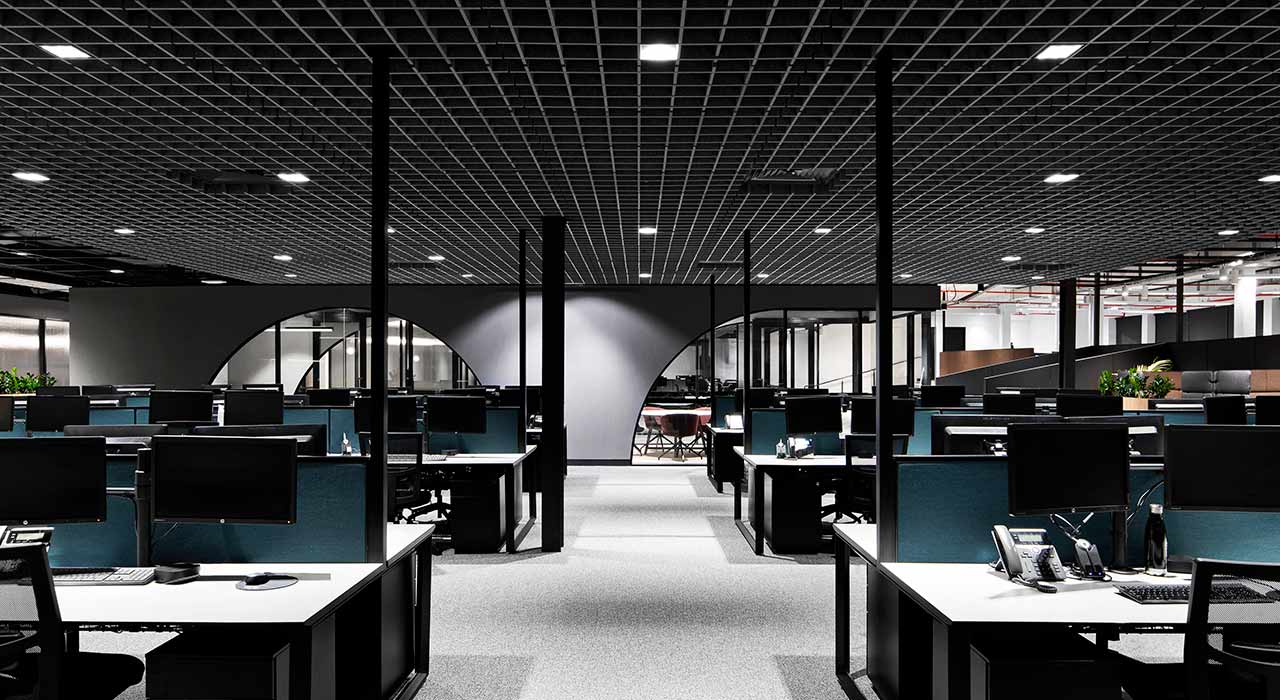 sound-absorbing drop ceiling tiles above open office