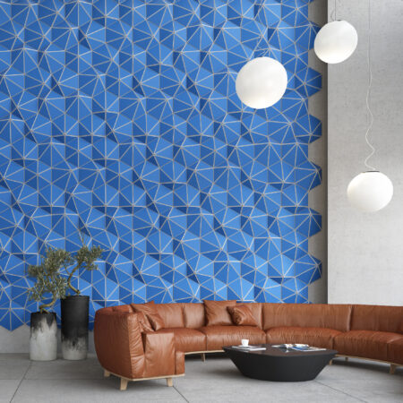 bright blue hexagon shaped acoustic tiles on office lobby wall