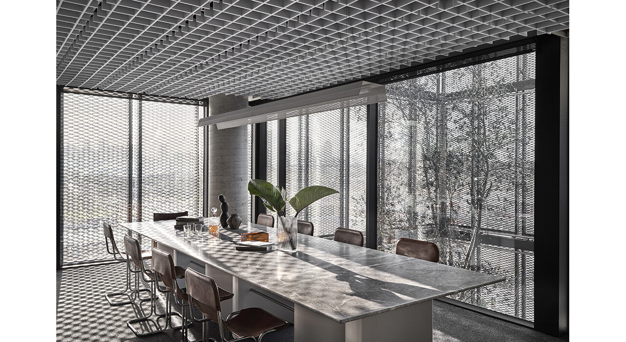 bright conference room with large windows sound absorbing drop ceiling tiles