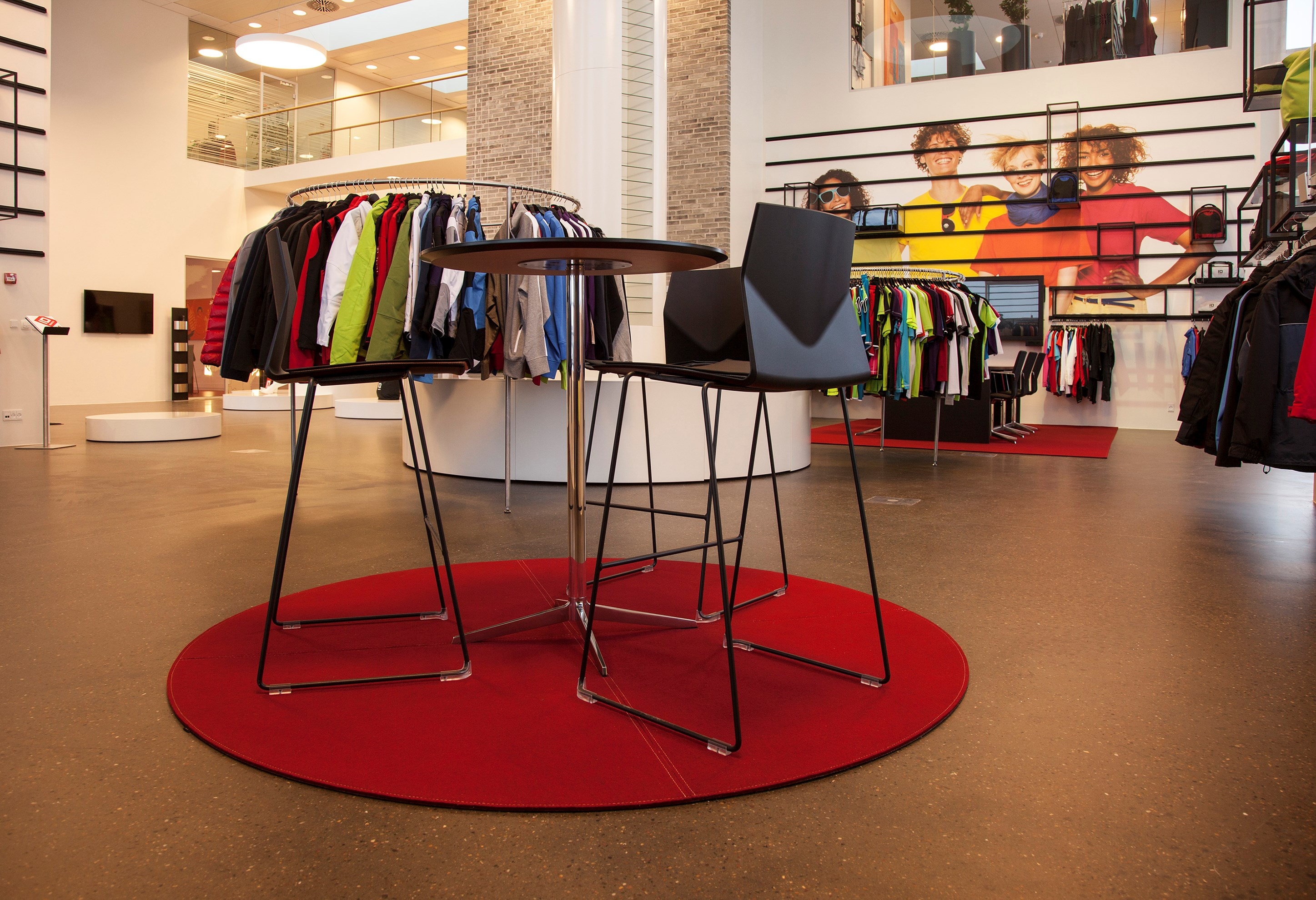 Round Fraster Felt Rug in color Red under seating