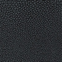 detail of a bubbly textured dark grey leather finish