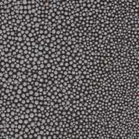 detail of a bubbly textured brown and light blue leather finish