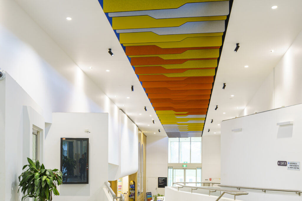 Multi Colored Custom Ceiling Screens at Monash Clayton Sports Building