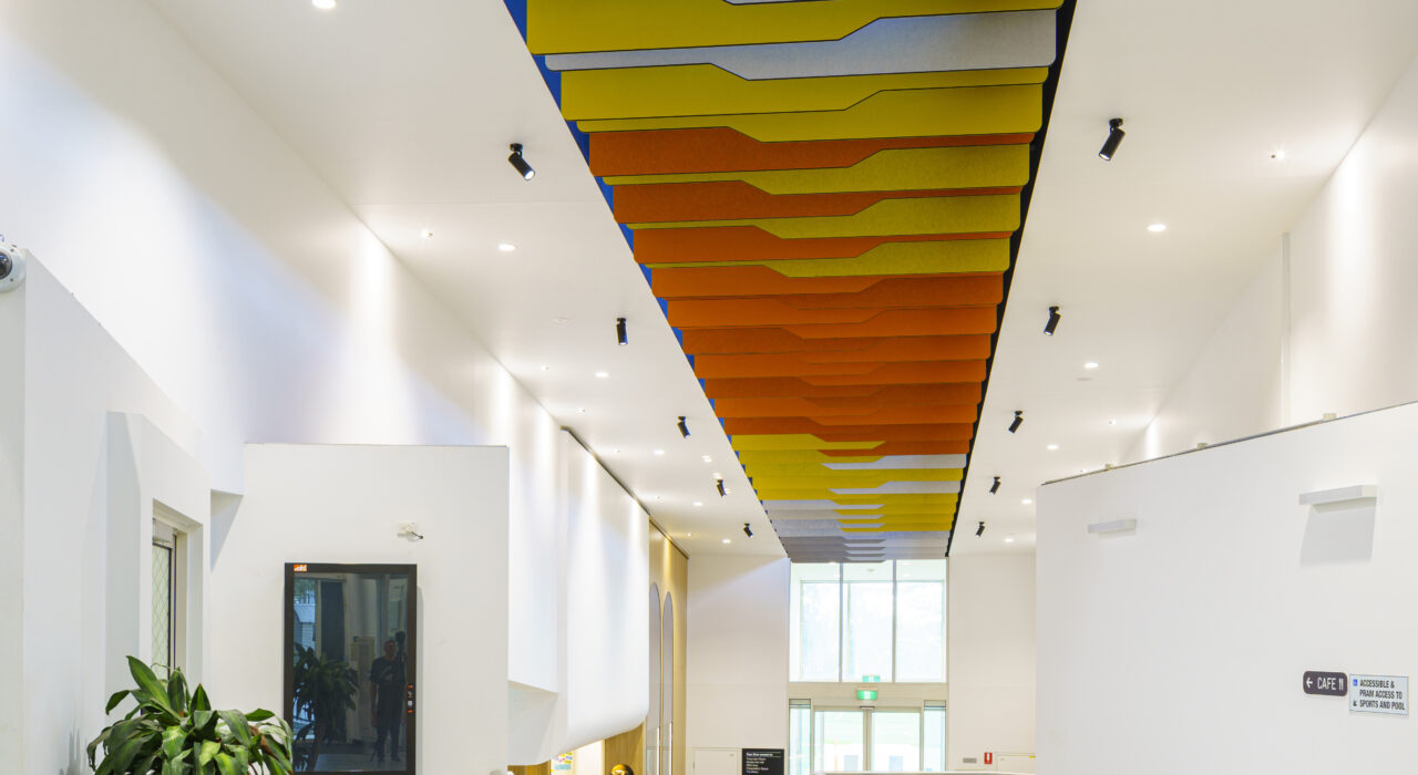 custom acoustic Screen hung above school lobby