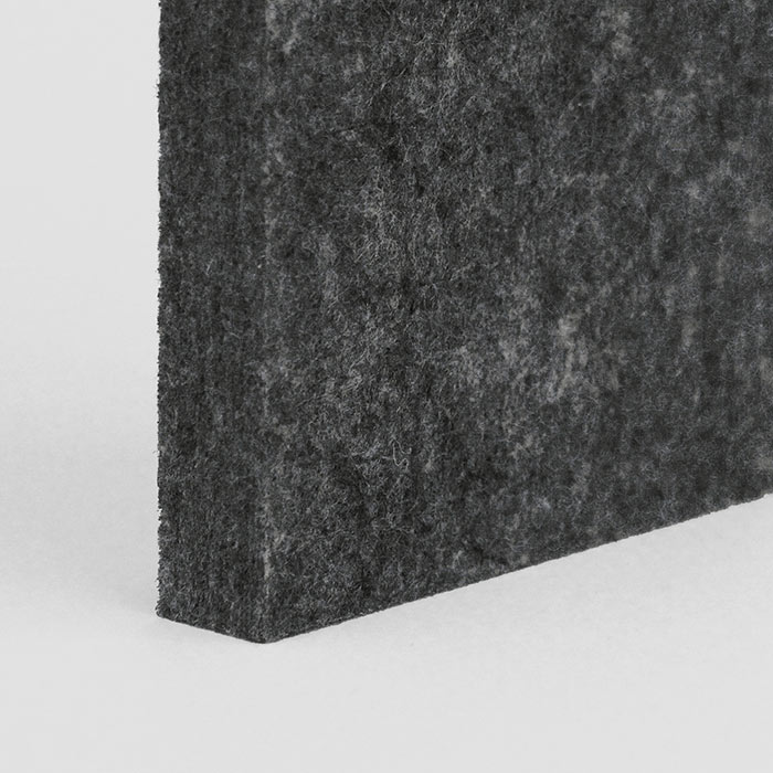 corner of a dark grey acoustic panel