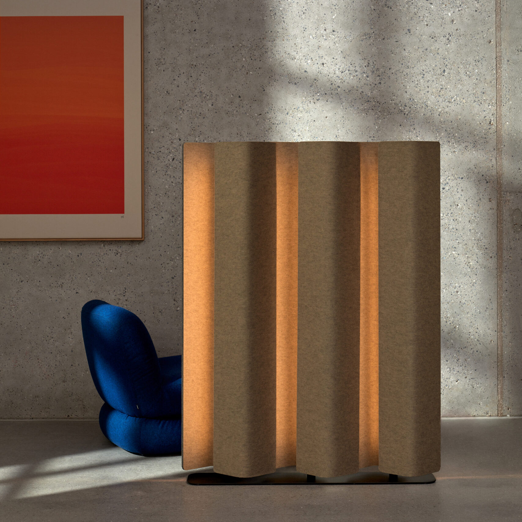 acoustic lighted floor screen in room with blue chair