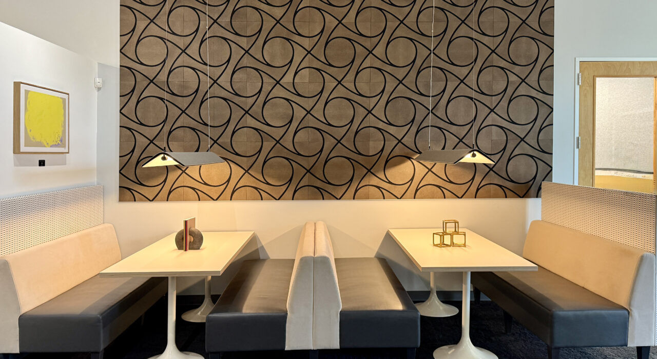 leather faced acoustic panels with geometric designs on wall in dining area